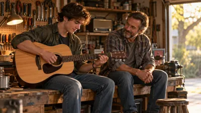 A young adult plays an acoustic guitar on a garage workbench while their father sits beside them listening with a smile, tools and an old radio softly out of focus, in warm afternoon light