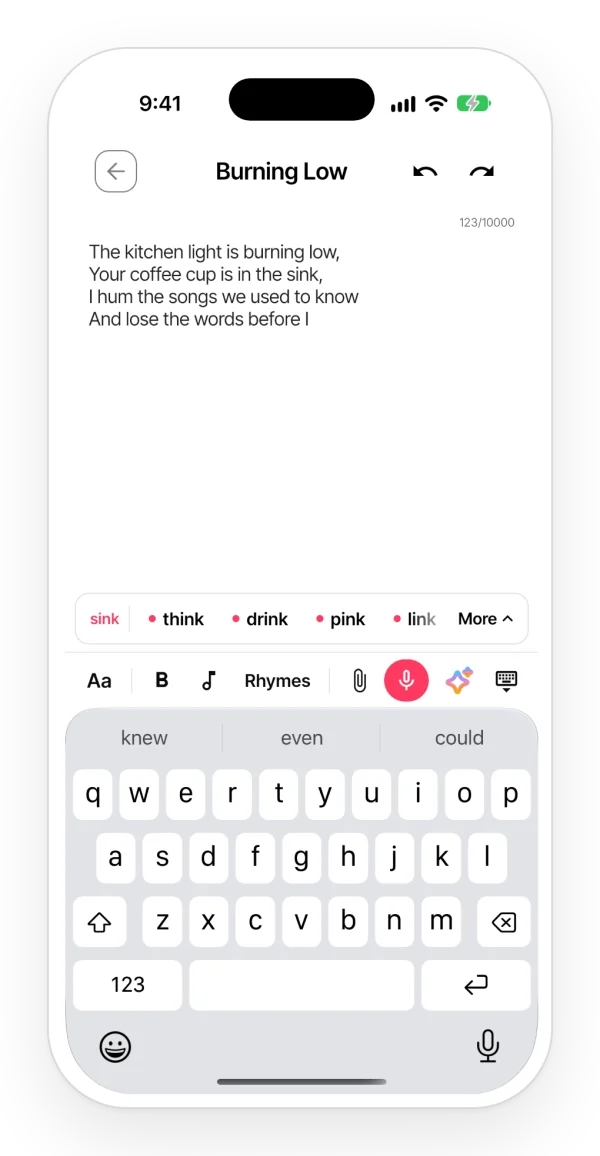A lyric open in the Zoundroom app with a row of rhymes above the keyboard; the words that fit the line are marked with a dot.